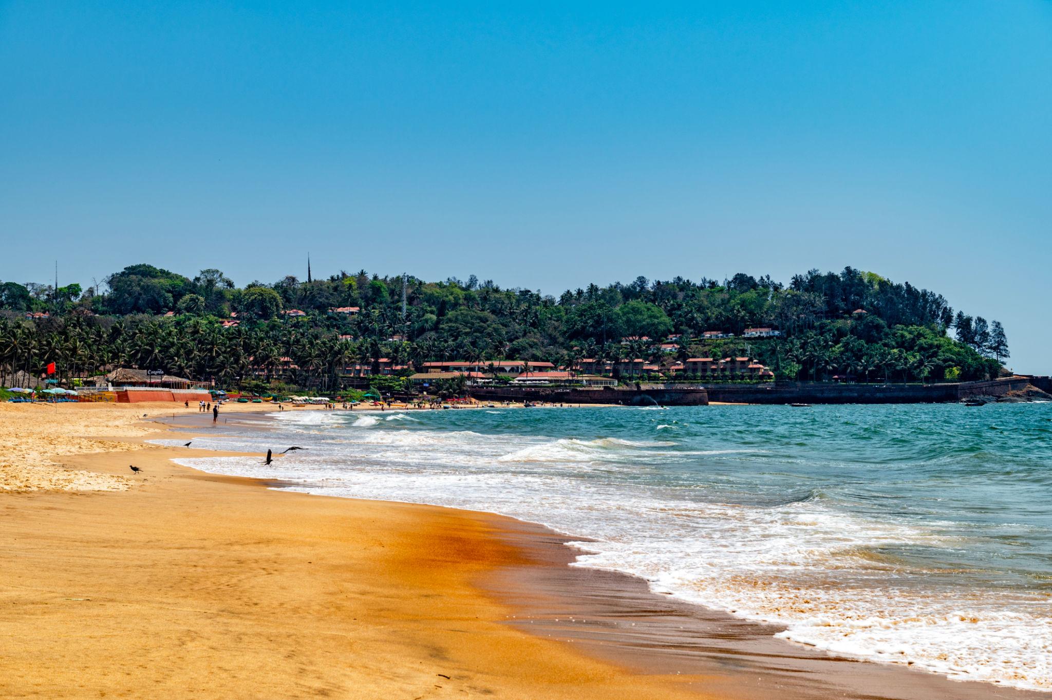 Candolim Beach Goa - Golden sand coastline and premium resorts in North Goa. Book private cab transfers with Cab Goa.